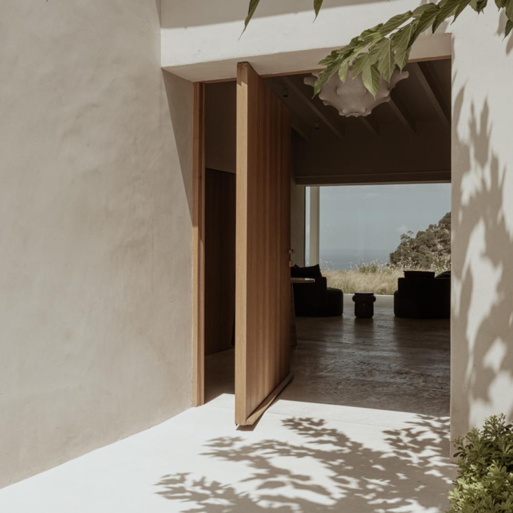 Pivot Door Framing a Sea View